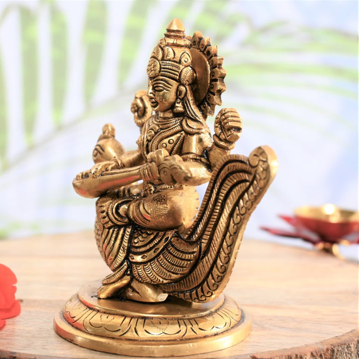 Brass saraswati idol with peacock veena small for pooja saraswati murti pital home decor gift